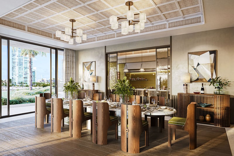 Private dining room with long marble table and coffered ceiling at The Residences at Six Fisher Island, Fisher Island Miami Beach Florida, adjoining chef kitchen and wine room; luxury and ultra luxury preconstruction condos entertaining space.