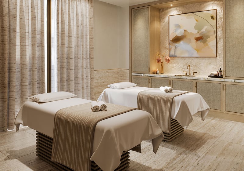 Spa treatment room with double massage tables at The Residences at Six Fisher Island, Fisher Island Miami Beach Florida; luxury and ultra luxury preconstruction condos offering serene wellness services.
