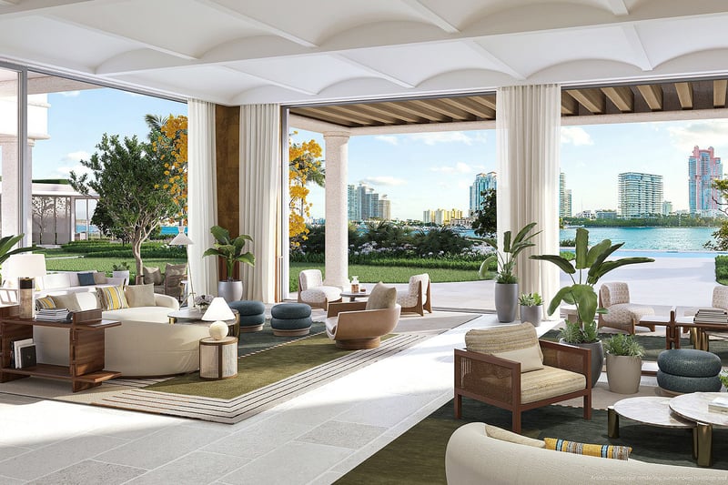 Open-air waterfront lounge at The Residences at Six Fisher Island, Fisher Island Miami Beach Florida, floor-to-ceiling openings to Biscayne Bay and skyline; luxury and ultra luxury preconstruction condos amenity.