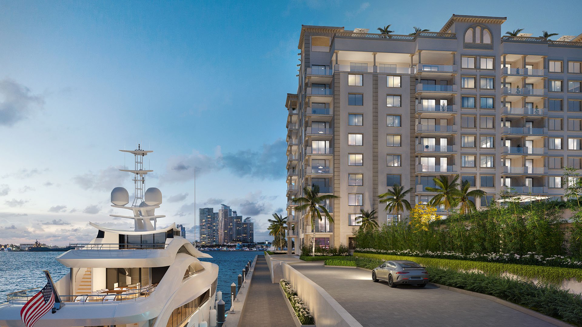 West Dock marina arrival at The Residences at Six Fisher Island, Fisher Island Miami Beach Florida, luxury condo exterior at dusk with yacht and waterfront drive; ultra luxury preconstruction condos on Biscayne Bay.