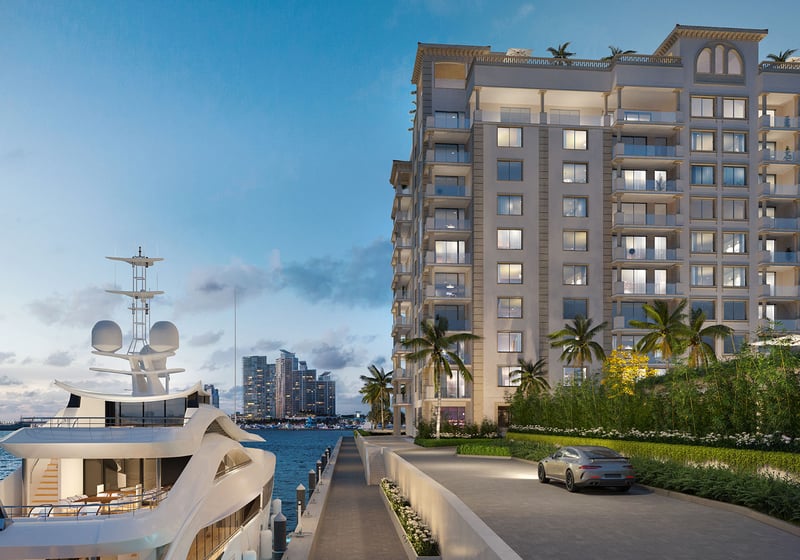 West Dock marina arrival at The Residences at Six Fisher Island, Fisher Island Miami Beach Florida, luxury condo exterior at dusk with yacht and waterfront drive; ultra luxury preconstruction condos on Biscayne Bay.