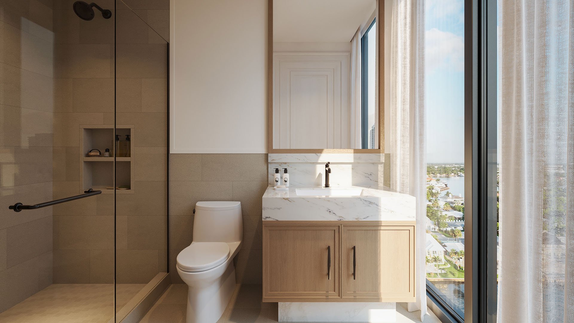 Spa bathroom at The Ritz-Carlton Residences, Fort Lauderdale, with a glass shower, single vanity, floor-to-ceiling window, and a water view inside one of the luxury and ultra luxury condos.