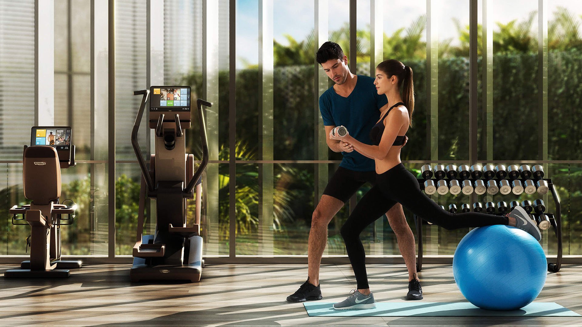 Fitness center with cardio machines, free weights and guided training at The Ritz-Carlton Residences Miami Beach in Miami Beach, an amenity for the luxury and ultra luxury condos.