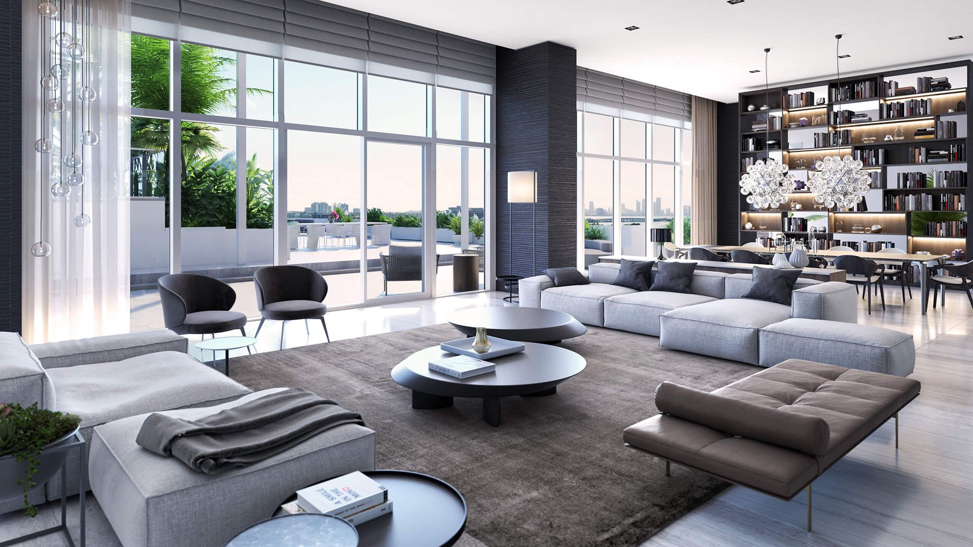 Grand living room with a library dining area, double-height glass and terrace access at The Ritz-Carlton Residences Miami Beach in Miami Beach, inside the luxury and ultra luxury condos.