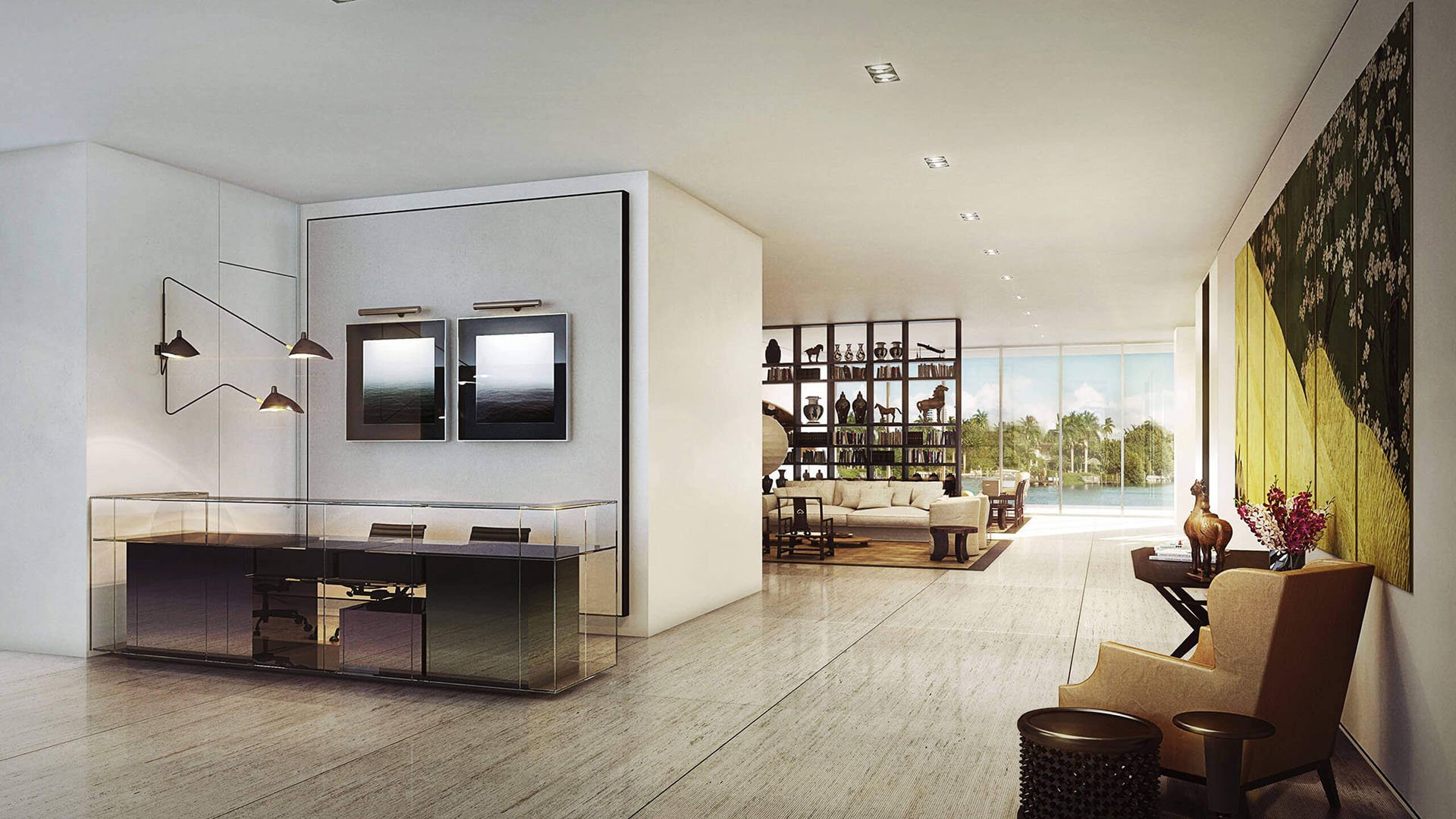 Modern entry foyer with a glass console desk, framed artwork and an open view to the waterfront living area at The Ritz-Carlton Residences Miami Beach in Miami Beach, inside the luxury and ultra luxury condos.