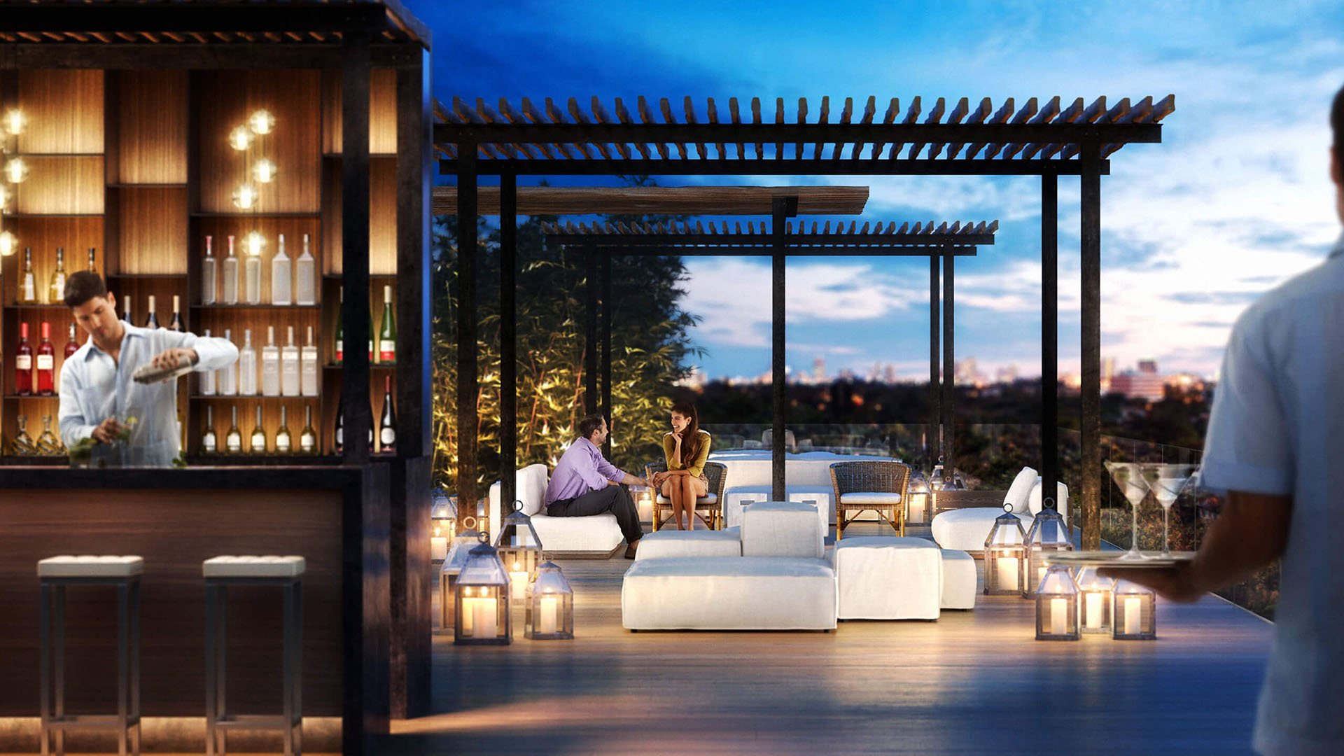 Rooftop bar and pergola lounge at dusk with candlelight seating and skyline views at The Ritz-Carlton Residences Miami Beach in Miami Beach, an amenity for the luxury and ultra luxury condos.
