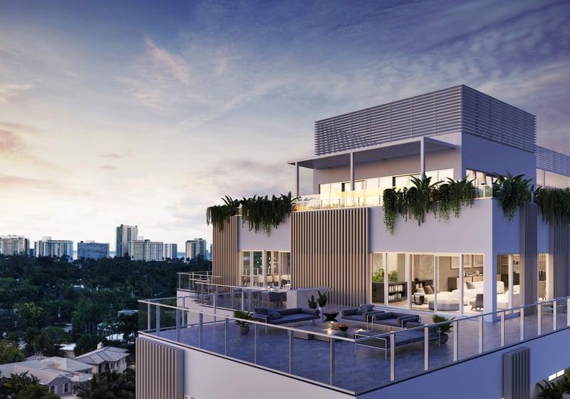 Sunset rooftop penthouse terrace at The Ritz-Carlton Residences Miami Beach in Miami Beach, showing luxury and ultra luxury condos with outdoor lounge seating, glowing interiors and a skyline backdrop.