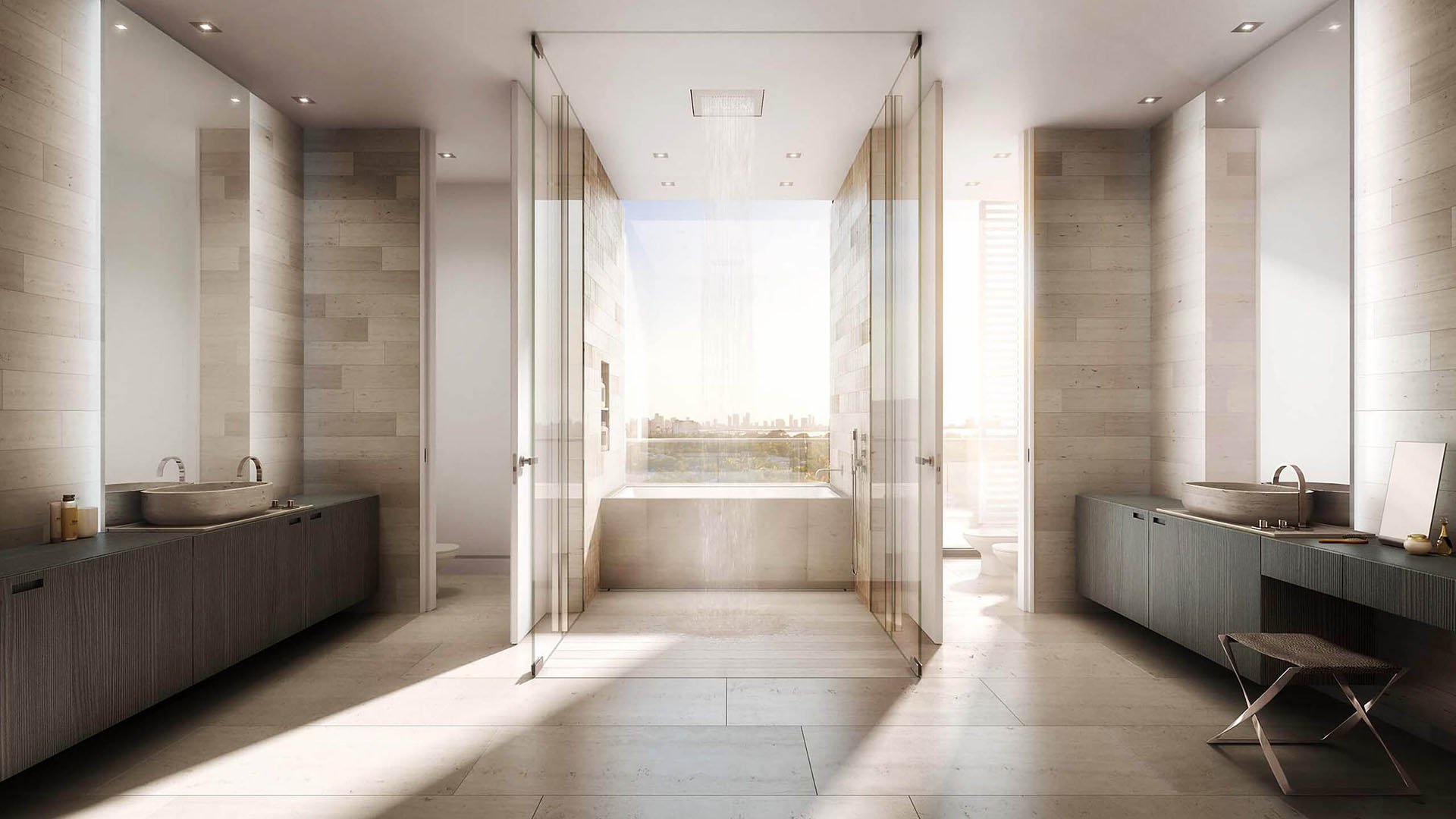 Spa bathroom with dual vanities, a glass shower and a soaking tub framed by city views at The Ritz-Carlton Residences Miami Beach in Miami Beach, inside the luxury and ultra luxury condos.