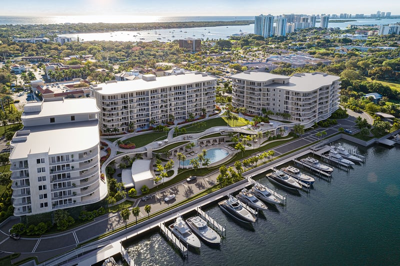 Aerial view of The Ritz-Carlton Residences Palm Beach Gardens waterfront marina and resort pool, Palm Beach Gardens, Florida, showcasing luxury and ultra luxury preconstruction condos with private yacht slips on the Intracoastal Waterway.
