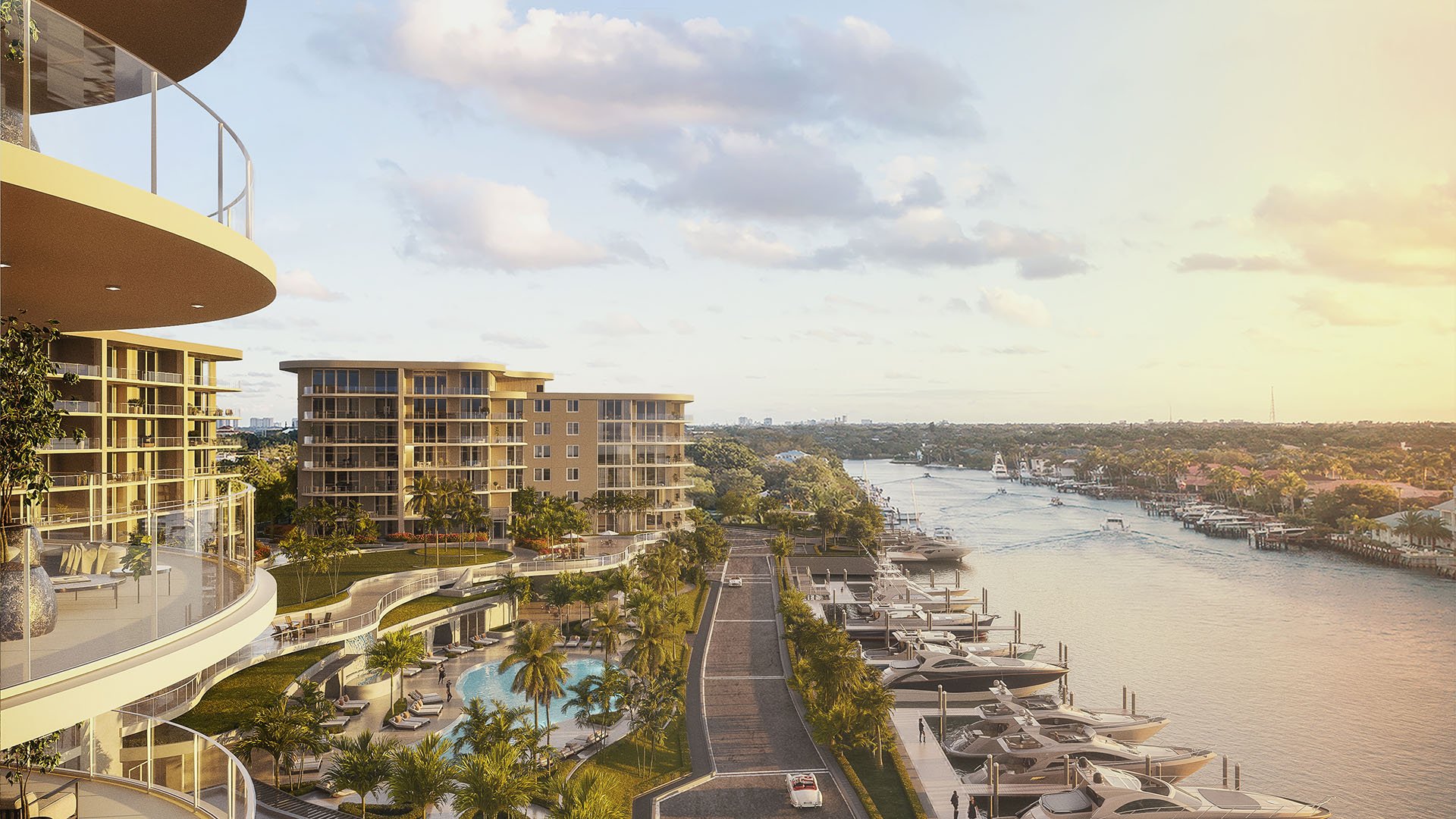 Curved glass balconies overlooking marina yacht slips at sunset at The Ritz-Carlton Residences Palm Beach Gardens, Palm Beach Gardens, Florida, showcasing luxury and ultra luxury preconstruction condos on the Intracoastal Waterway.