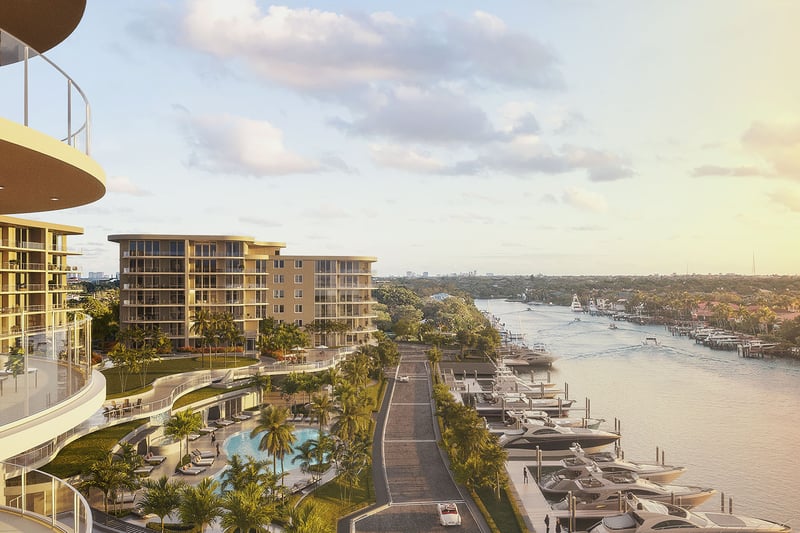 Curved glass balconies overlooking marina yacht slips at sunset at The Ritz-Carlton Residences Palm Beach Gardens, Palm Beach Gardens, Florida, showcasing luxury and ultra luxury preconstruction condos on the Intracoastal Waterway.