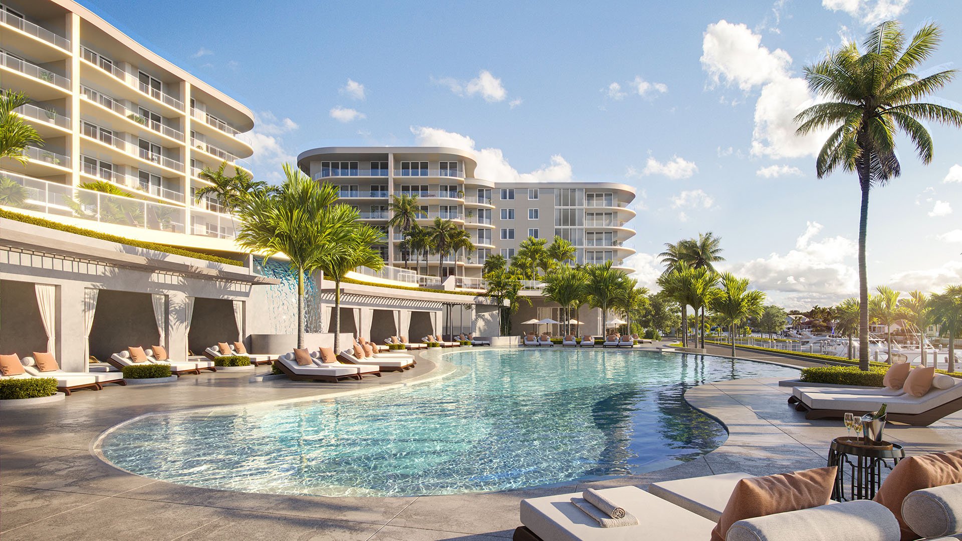 Resort-style curved pool with cabanas and loungers at The Ritz-Carlton Residences Palm Beach Gardens waterfront in Palm Beach Gardens, Florida, highlighting luxury and ultra luxury preconstruction condos with palm-tree views near the marina.