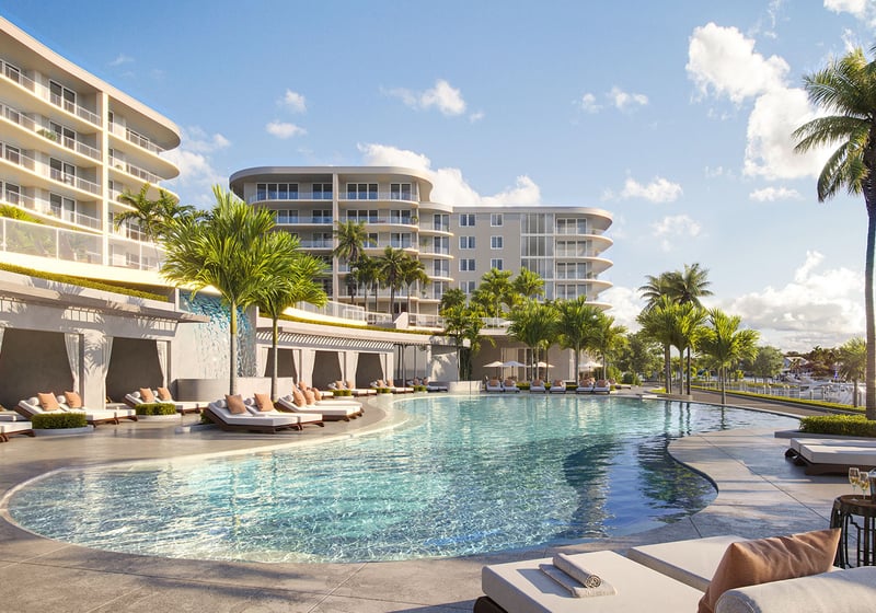 Resort-style curved pool with cabanas and loungers at The Ritz-Carlton Residences Palm Beach Gardens waterfront in Palm Beach Gardens, Florida, highlighting luxury and ultra luxury preconstruction condos with palm-tree views near the marina.