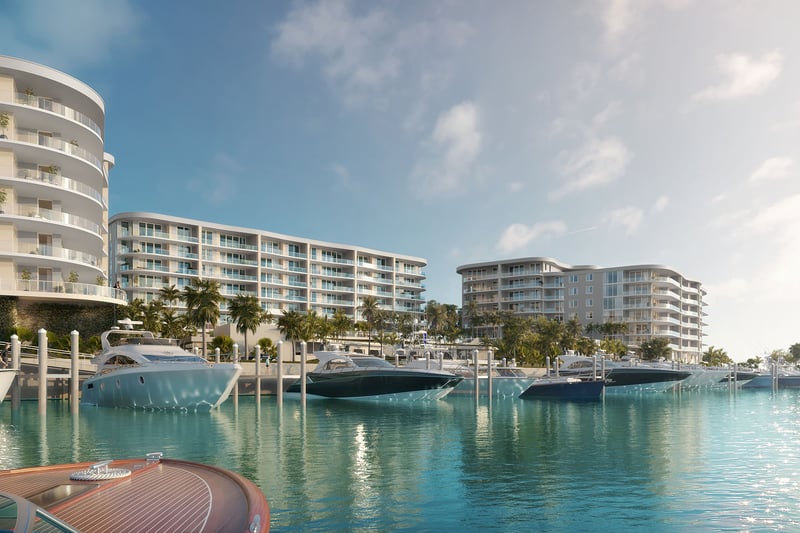 Daytime marina scene with private yacht slips and waterfront towers at The Ritz-Carlton Residences Palm Beach Gardens, Palm Beach Gardens, Florida, highlighting luxury and ultra luxury preconstruction condos on the Intracoastal Waterway.