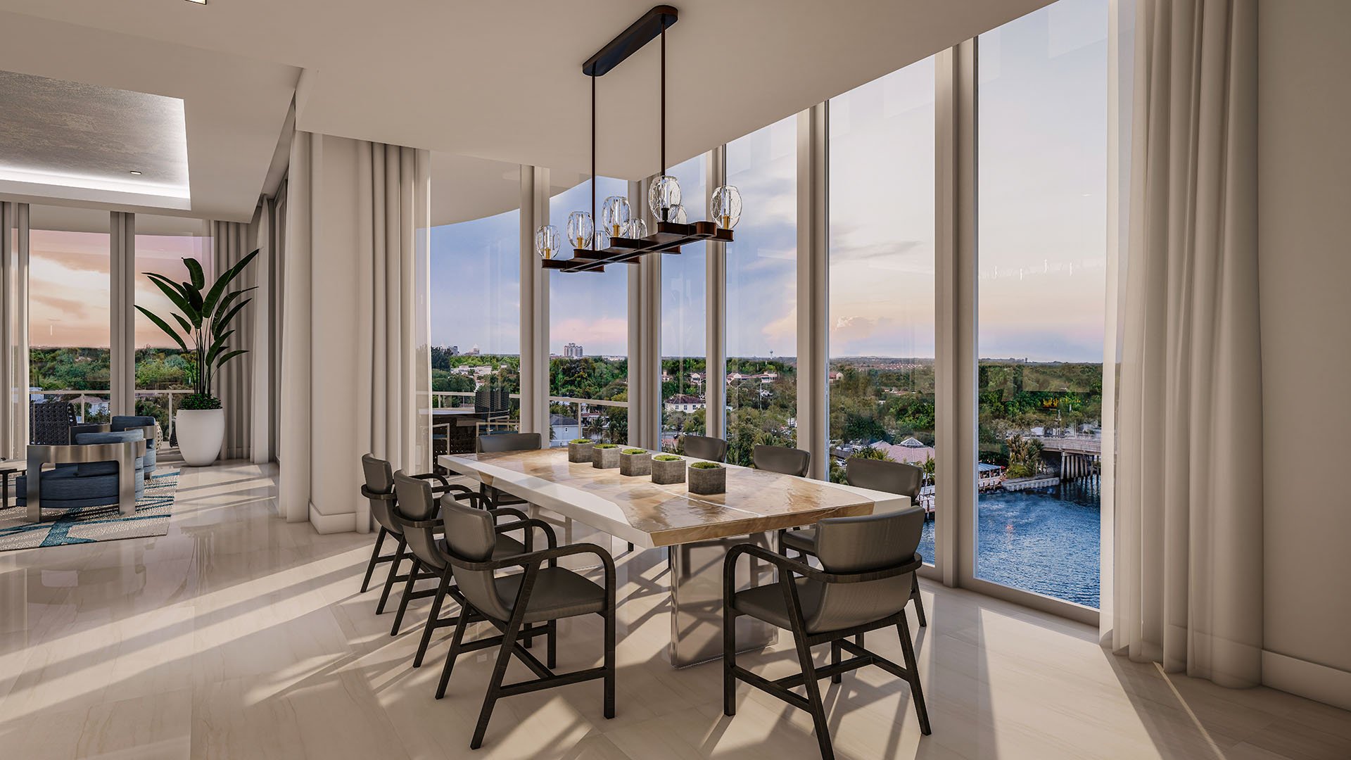 The Ritz-Carlton Residences Palm Beach Gardens Residence C dining room with long table and floor-to-ceiling corner windows overlooking the Intracoastal Waterway, Palm Beach Gardens, Florida. Luxury and ultra luxury preconstruction condos.