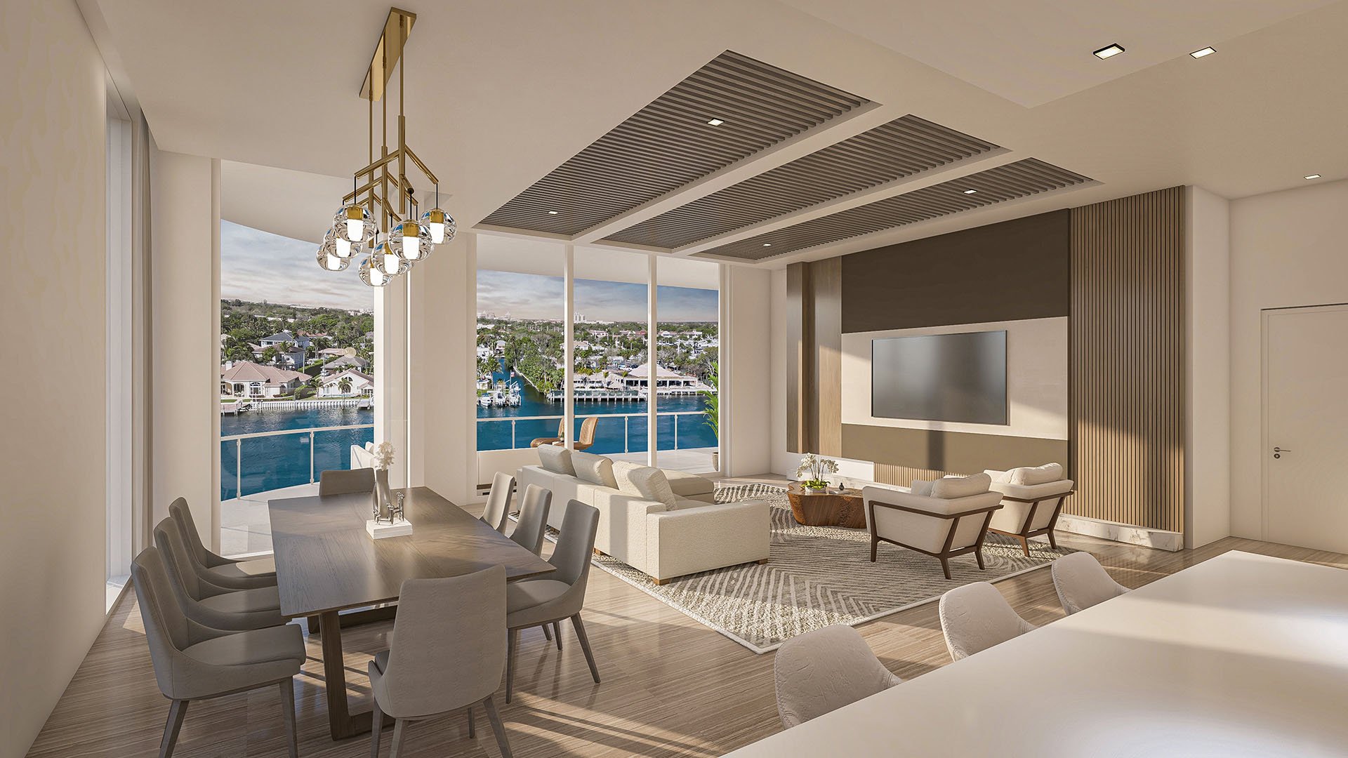 Residence F east building great room with open living and dining, wall-mounted TV and waterway-view balcony at The Ritz-Carlton Residences, Palm Beach Gardens, Florida, showcasing luxury and ultra luxury preconstruction condos.