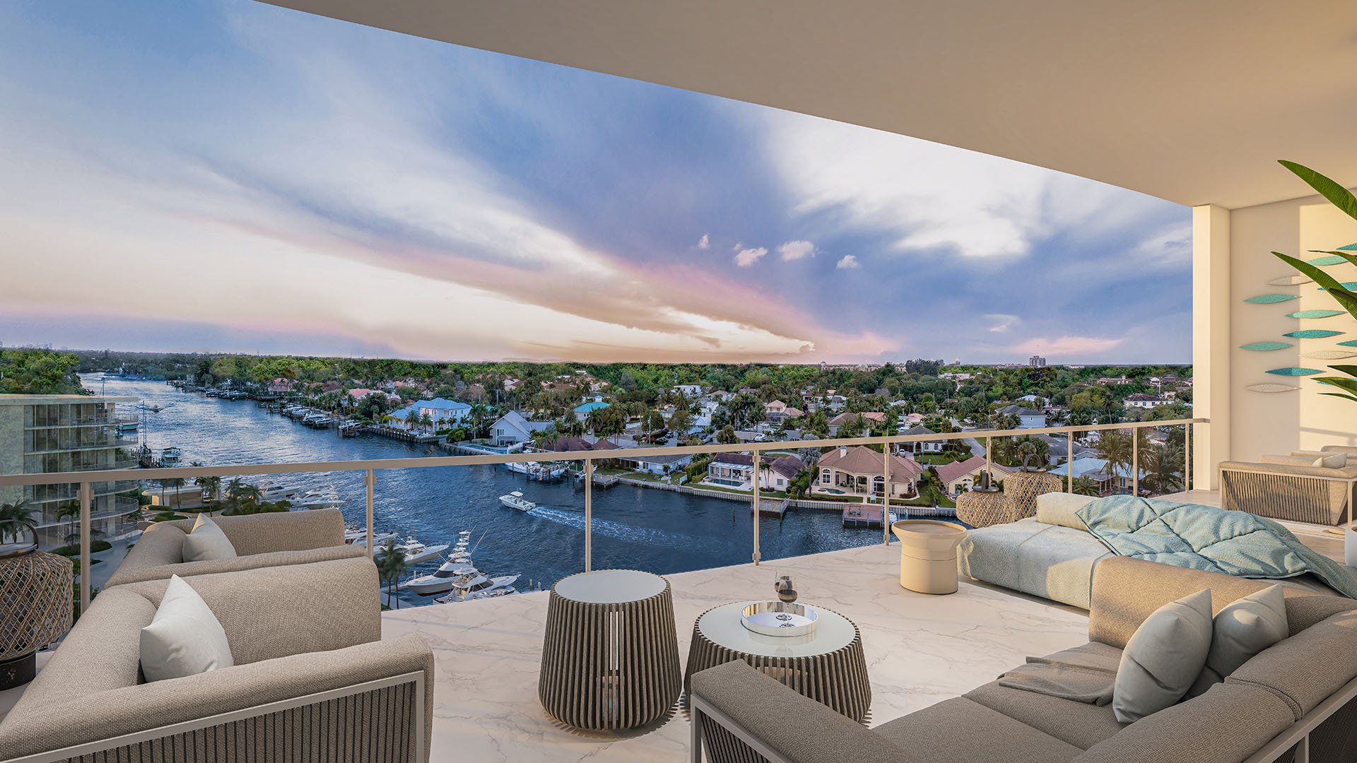 Residence G north building balcony with outdoor lounge seating and dramatic Intracoastal Waterway sunset view at The Ritz-Carlton Residences, Palm Beach Gardens, Florida, showcasing luxury and ultra luxury preconstruction condos.