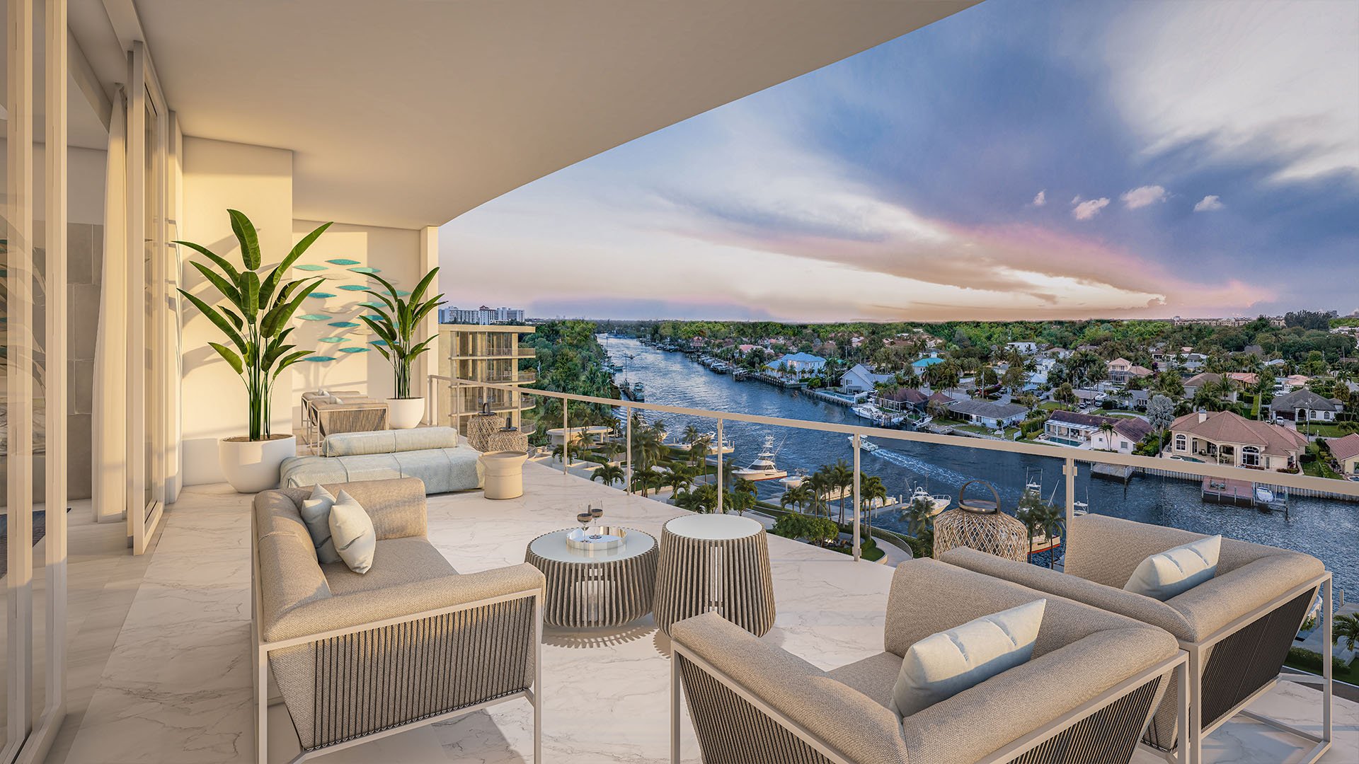 The Ritz-Carlton Residences, Palm Beach Gardens FL east building balcony with modern outdoor lounge on marble flooring, panoramic Intracoastal waterway sunset views, highlighting luxury and ultra luxury preconstruction condos waterfront living.