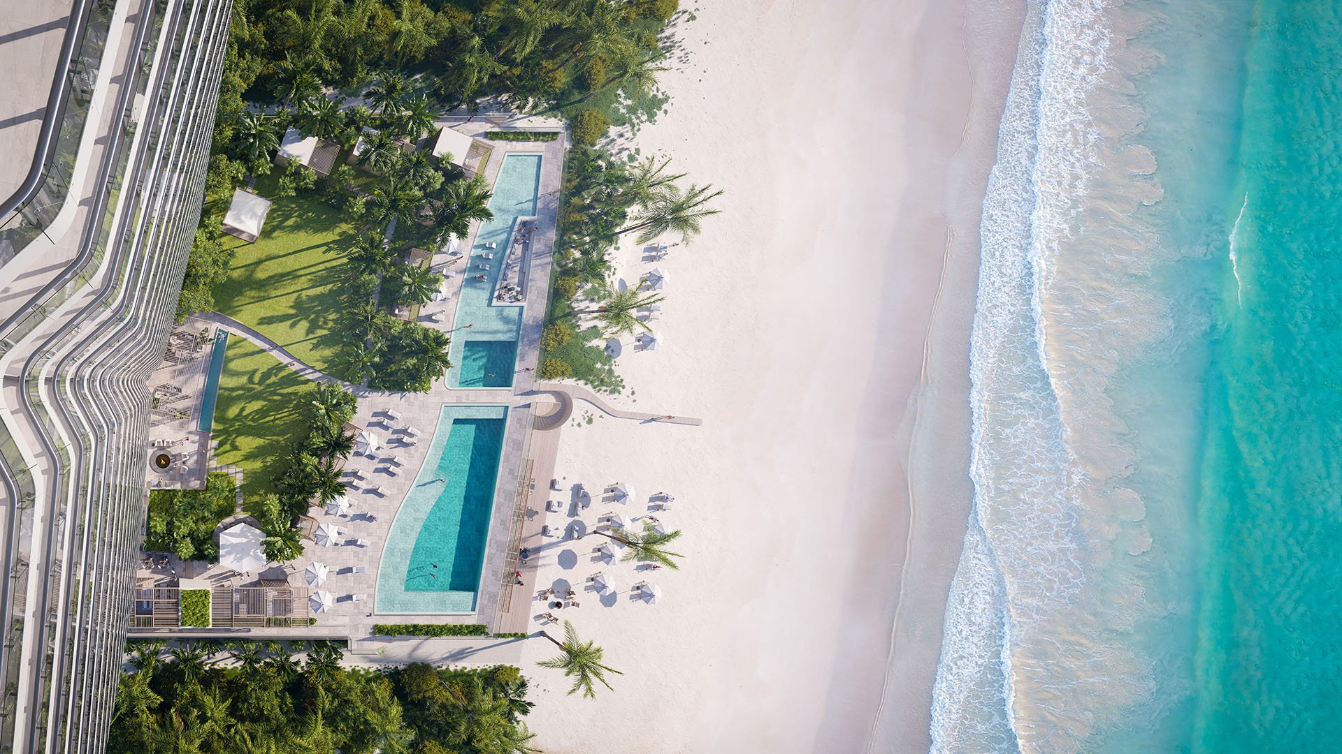 Aerial top-down view of The Ritz-Carlton Residences Pompano Beach, Florida Beach Tower pool deck beside the Atlantic, with resort pools, cabanas and white-sand beach, highlighting luxury and ultra luxury preconstruction condos amenities.