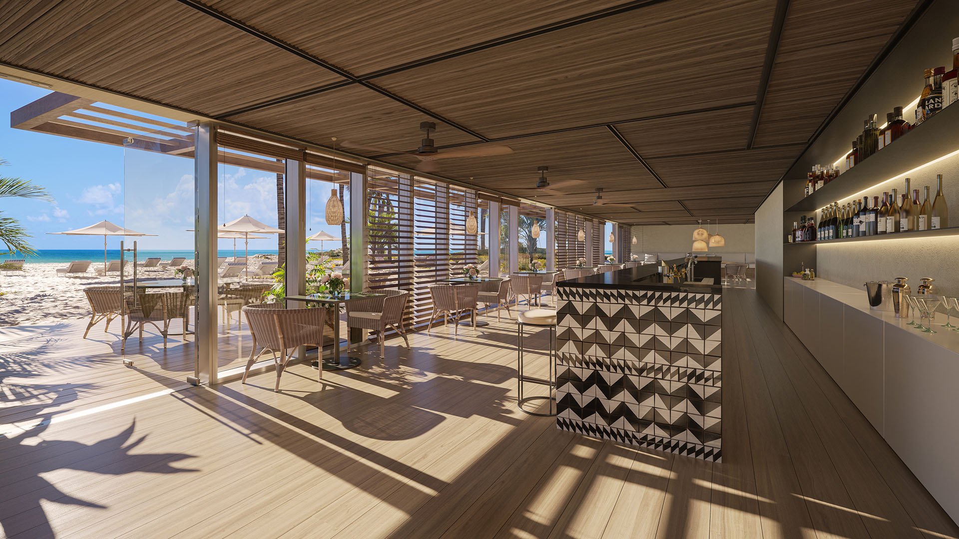 Oceanfront beach club restaurant and bar at The Ritz-Carlton Residences Pompano Beach, Florida Beach Tower, with indoor-outdoor dining overlooking the beach, representing luxury and ultra luxury preconstruction condos lifestyle.