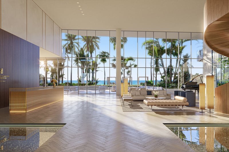 Double-height lobby with reception desk and floor-to-ceiling ocean views at The Ritz-Carlton Residences Pompano Beach, Florida Beach Tower, setting the tone for luxury and ultra luxury preconstruction condos with Ritz-Carlton service.