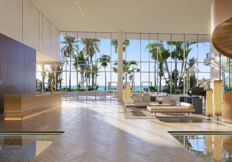 Double-height lobby with reception desk and floor-to-ceiling ocean views at The Ritz-Carlton Residences Pompano Beach, Florida Beach Tower, setting the tone for luxury and ultra luxury preconstruction condos with Ritz-Carlton service.