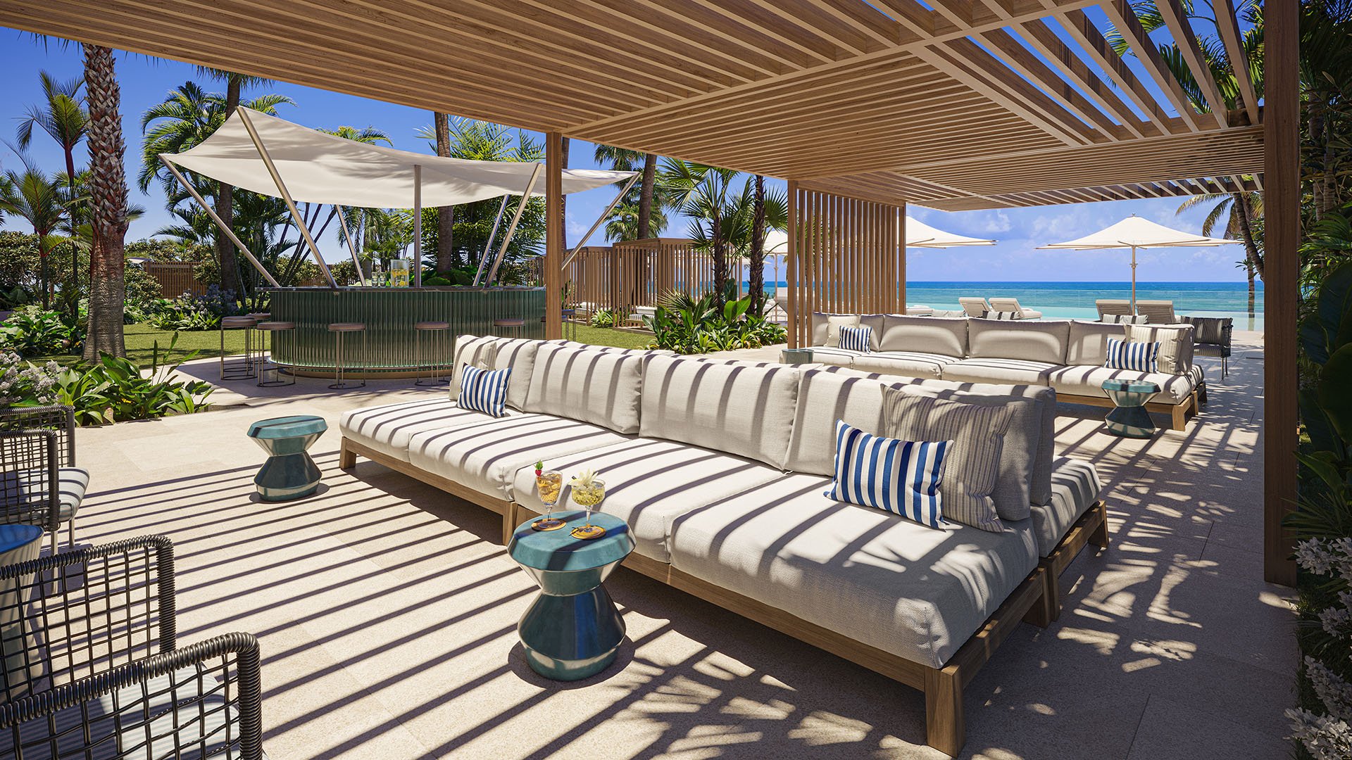 Outdoor amenity deck lounge with cabana bar and ocean views at The Ritz-Carlton Residences Pompano Beach, Florida Beach Tower, highlighting luxury and ultra luxury preconstruction condos with resort-style social spaces.