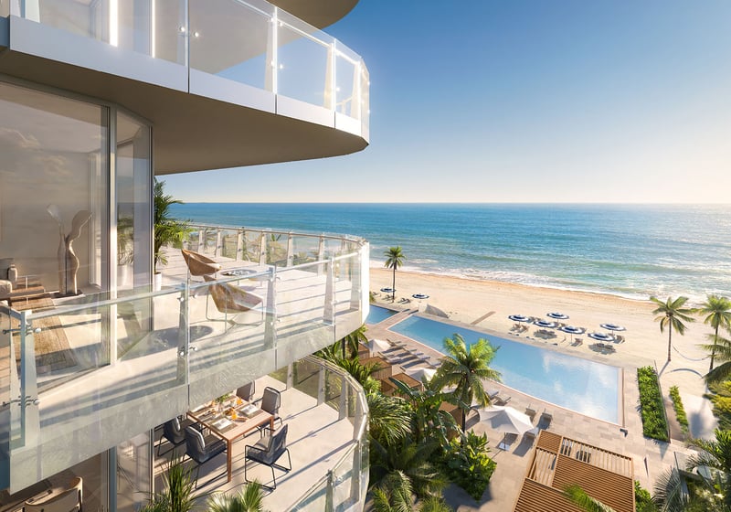 Private balcony terrace with seating and ocean view overlooking the amenity pool at The Ritz-Carlton Residences Pompano Beach, Florida Beach Tower, representing luxury and ultra luxury preconstruction condos indoor-outdoor living.