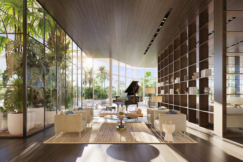 Marina Tower bar and lounge at The Ritz-Carlton Residences Pompano Beach, Florida, with grand piano, curated library wall and waterfront views, showcasing luxury and ultra luxury preconstruction condos social amenity spaces.