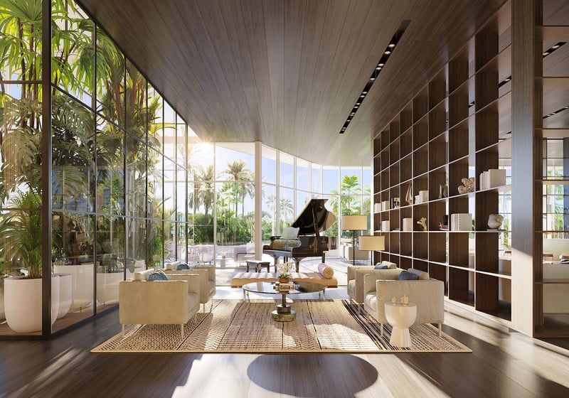 Marina Tower bar and lounge at The Ritz-Carlton Residences Pompano Beach, Florida, with grand piano, curated library wall and waterfront views, showcasing luxury and ultra luxury preconstruction condos social amenity spaces.