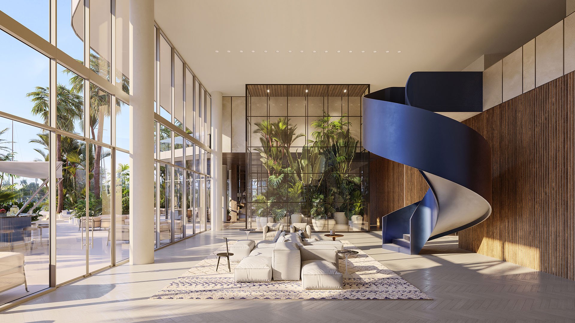 Marina Tower luxury lobby at The Ritz-Carlton Residences Pompano Beach, Florida featuring dramatic blue spiral staircase, tropical indoor garden and glass walls, reflecting luxury and ultra luxury preconstruction condos arrival experience.