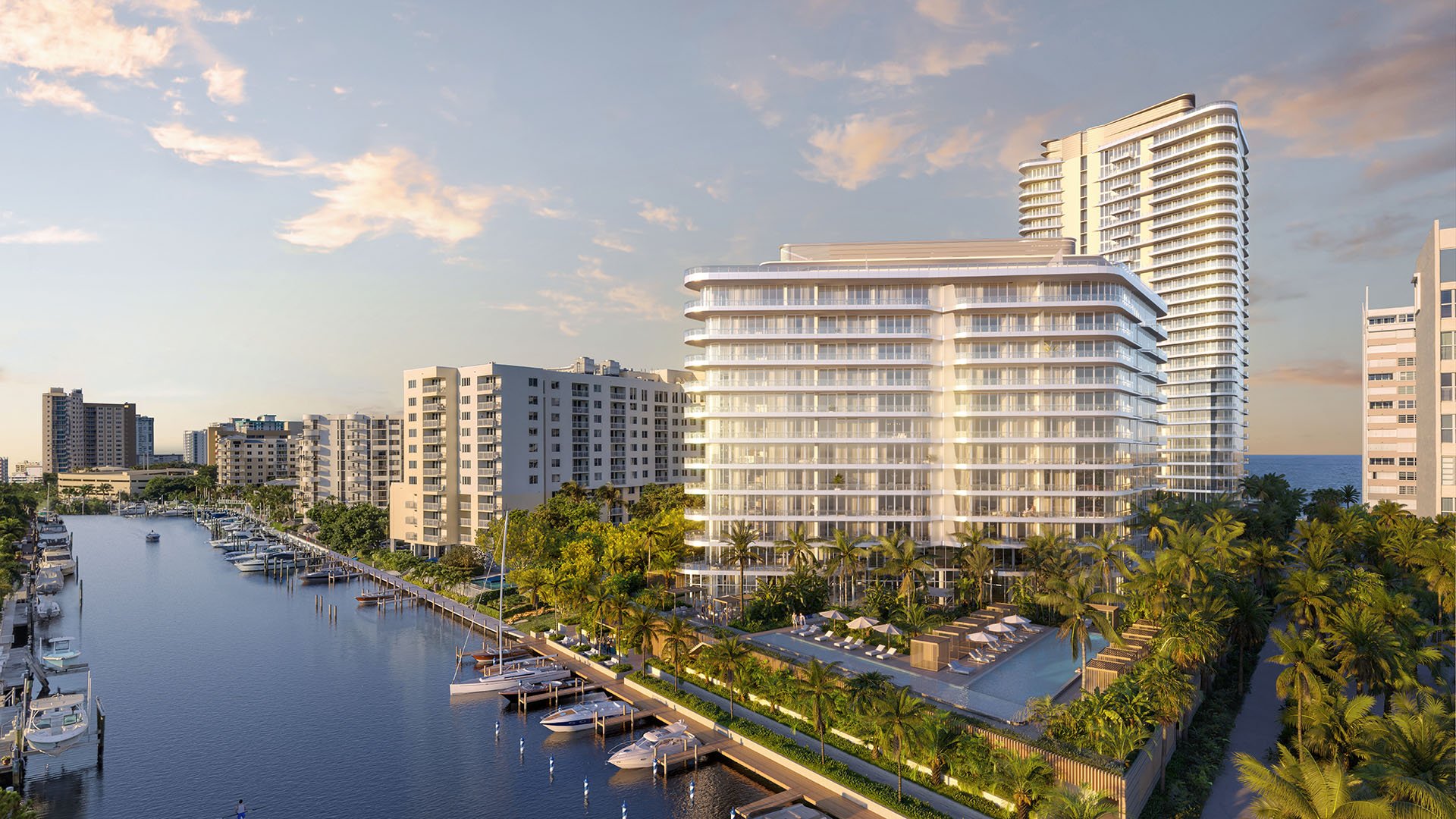 Aerial view of The Ritz-Carlton Residences Pompano Beach, Florida Marina Tower along the Intracoastal marina canal with ocean backdrop, showcasing luxury and ultra luxury preconstruction condos in a waterfront location.