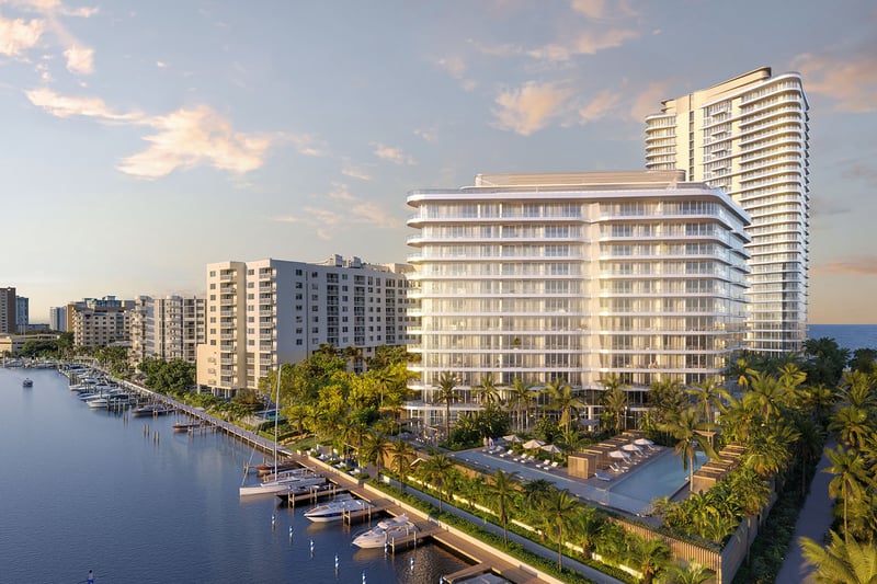 Aerial view of The Ritz-Carlton Residences Pompano Beach, Florida Marina Tower along the Intracoastal marina canal with ocean backdrop, showcasing luxury and ultra luxury preconstruction condos in a waterfront location.