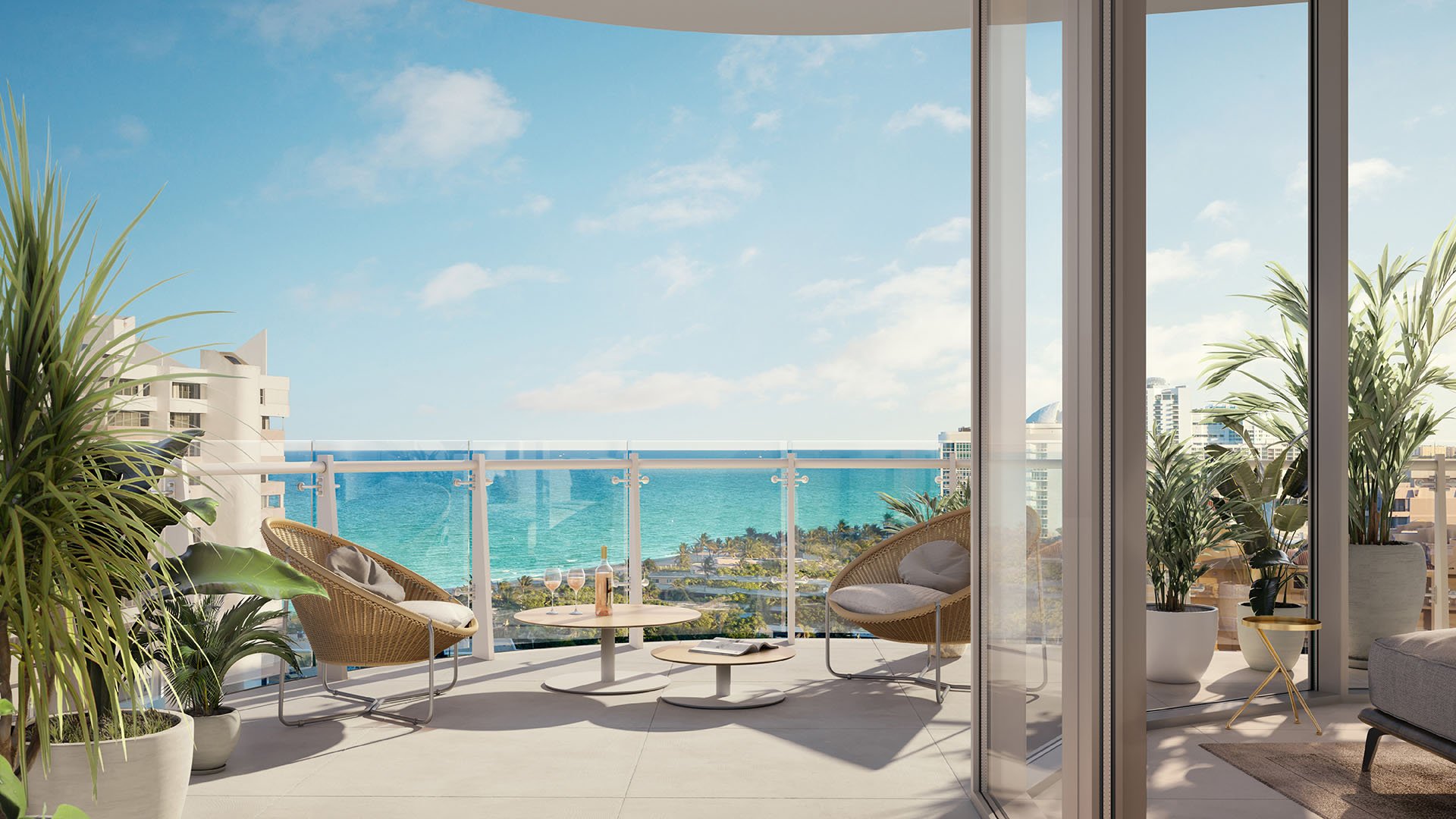 Marina Tower residence balcony terrace with lounge seating and ocean views at The Ritz-Carlton Residences Pompano Beach, Florida, emphasizing luxury and ultra luxury preconstruction condos with expansive indoor-outdoor living.