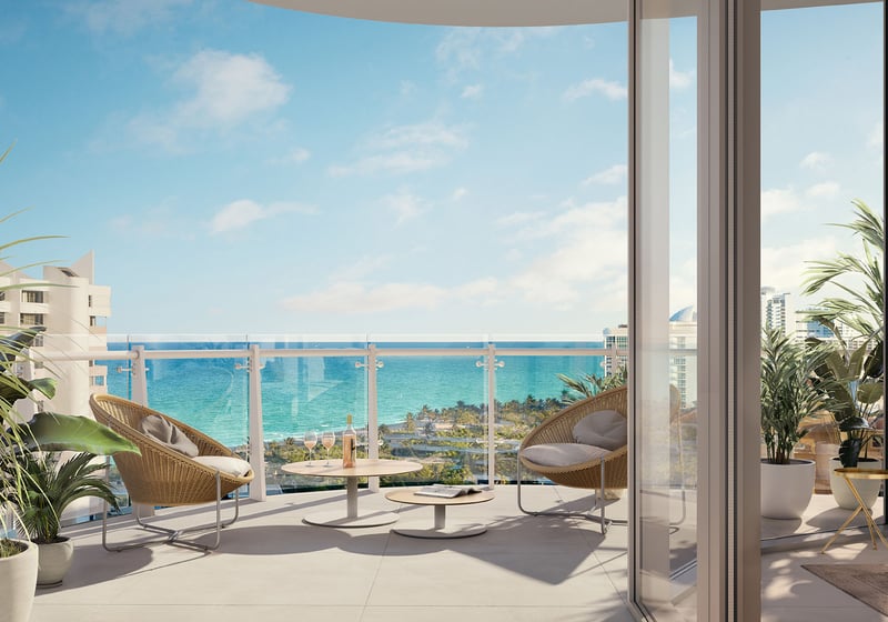 Marina Tower residence balcony terrace with lounge seating and ocean views at The Ritz-Carlton Residences Pompano Beach, Florida, emphasizing luxury and ultra luxury preconstruction condos with expansive indoor-outdoor living.