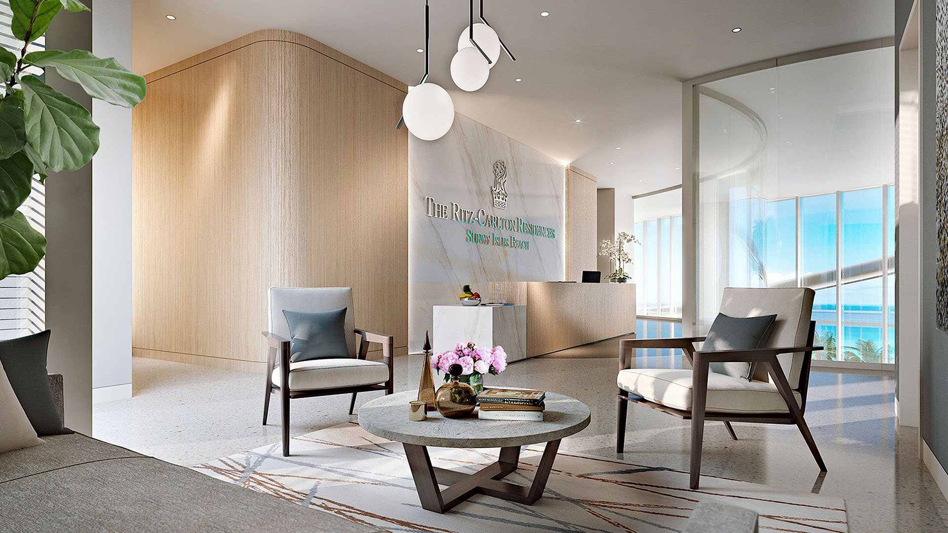 Arrival lobby with reception desk, seating area, and ocean light at The Ritz-Carlton Residences, Sunny Isles Beach, luxury and ultra luxury condos in Sunny Isles Beach.