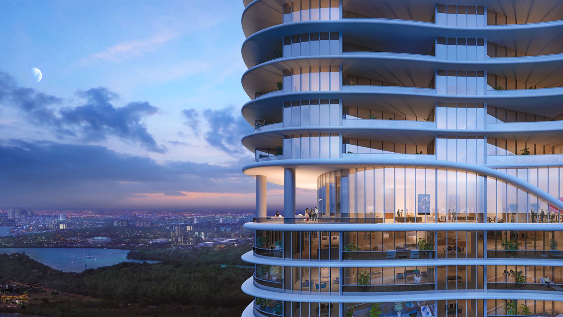 Curved exterior balconies glow at dusk above the skyline at The Ritz-Carlton Residences, Sunny Isles Beach, luxury and ultra luxury condos in Sunny Isles Beach.