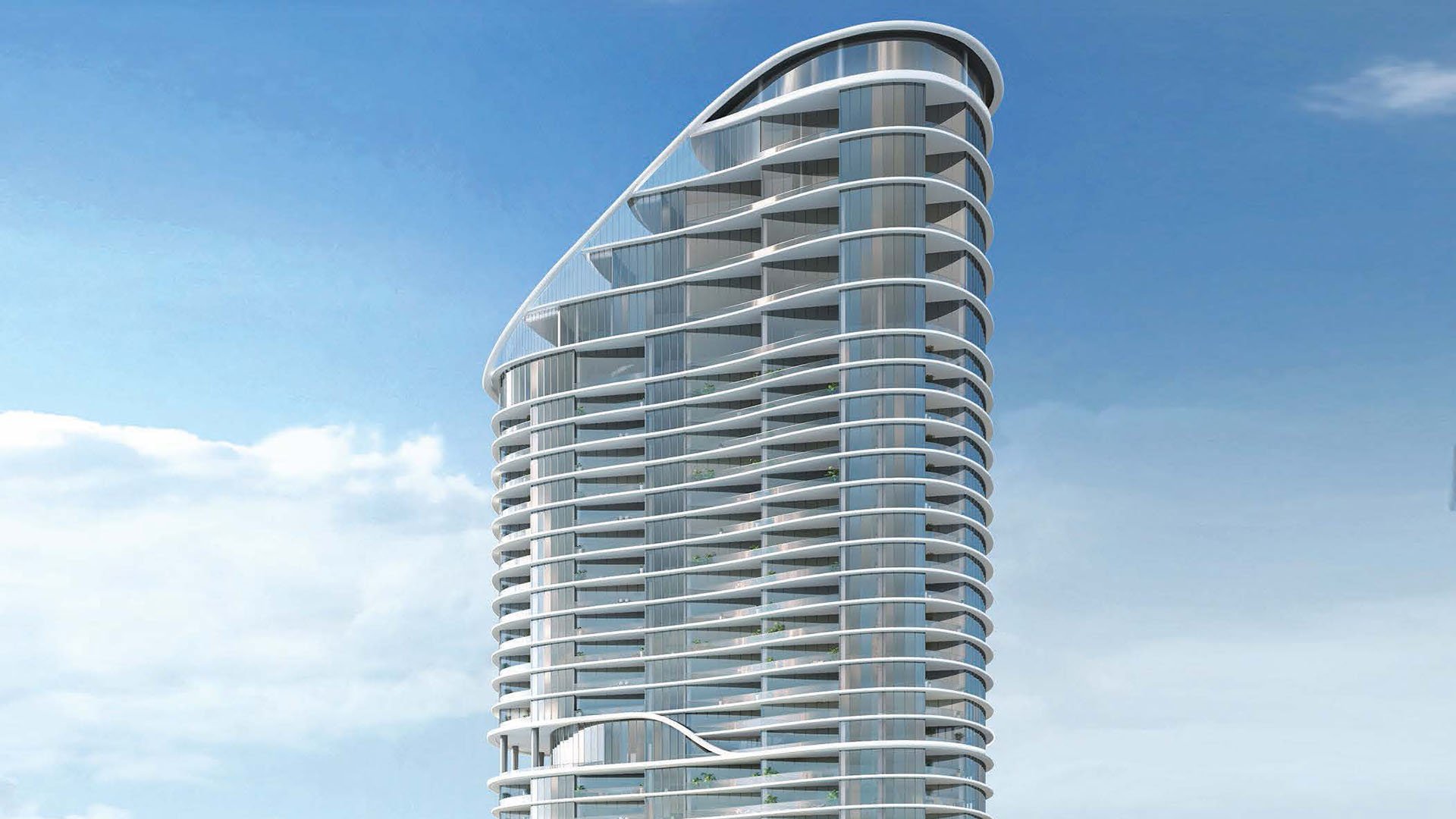 Signature curved tower exterior rising against a blue sky at The Ritz-Carlton Residences, Sunny Isles Beach, luxury and ultra luxury condos in Sunny Isles Beach.