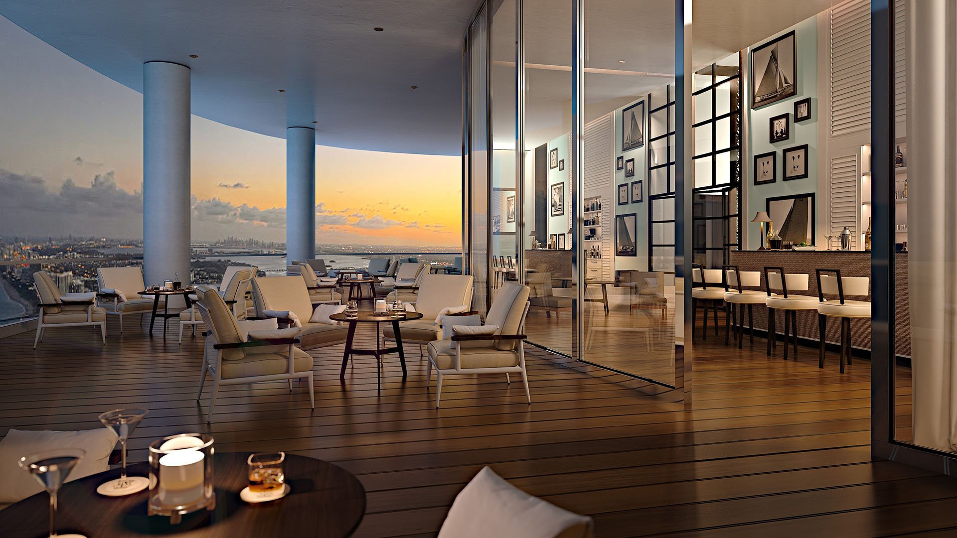 Sunset club terrace with bar seating and intracoastal skyline views at The Ritz-Carlton Residences, Sunny Isles Beach, luxury and ultra luxury condos in Sunny Isles Beach.