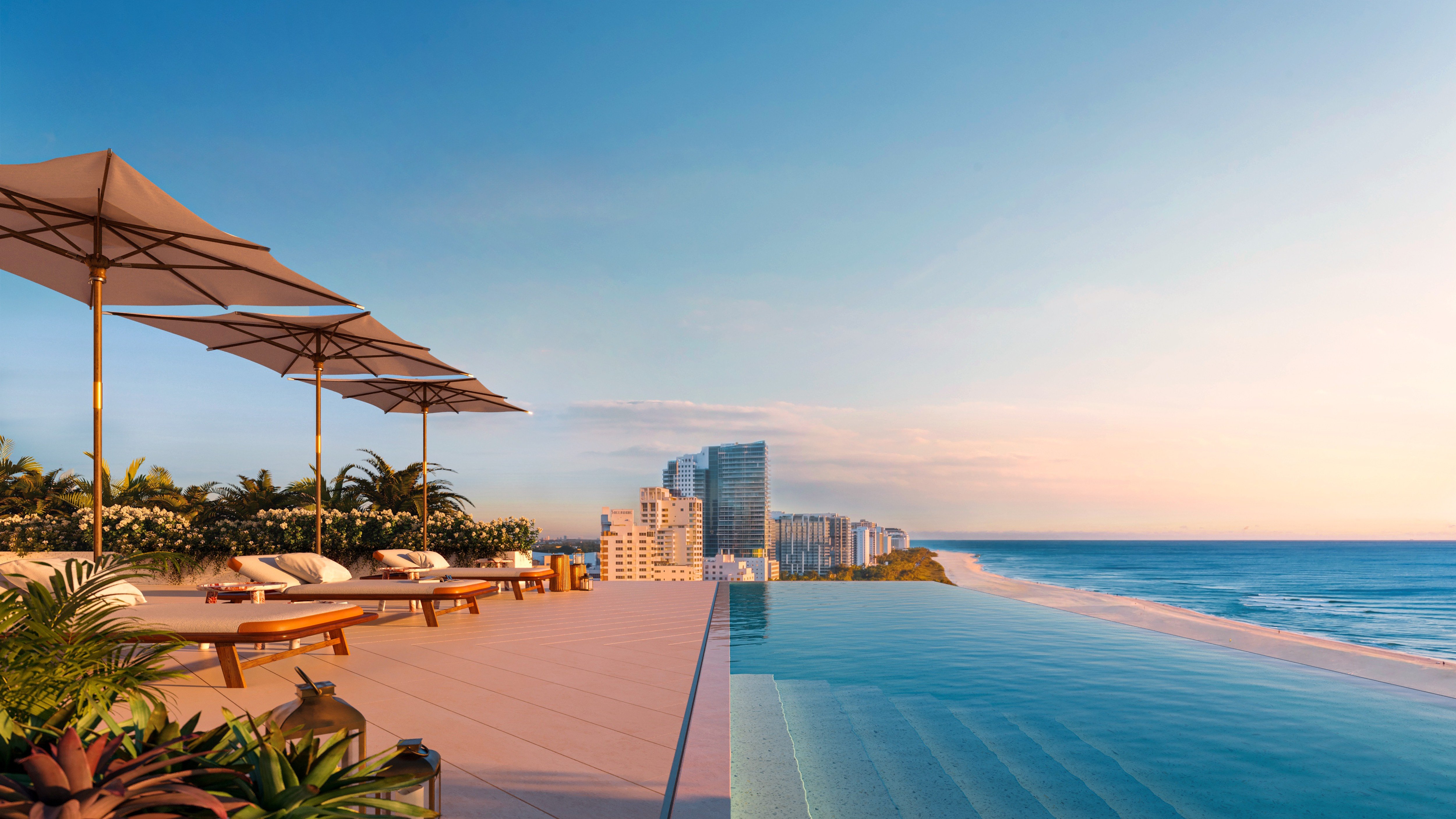 The Ritz‑Carlton South Beach infinity pool with ocean view, Miami Beach, five‑star amenity amid luxury and ultra luxury condos; resale.