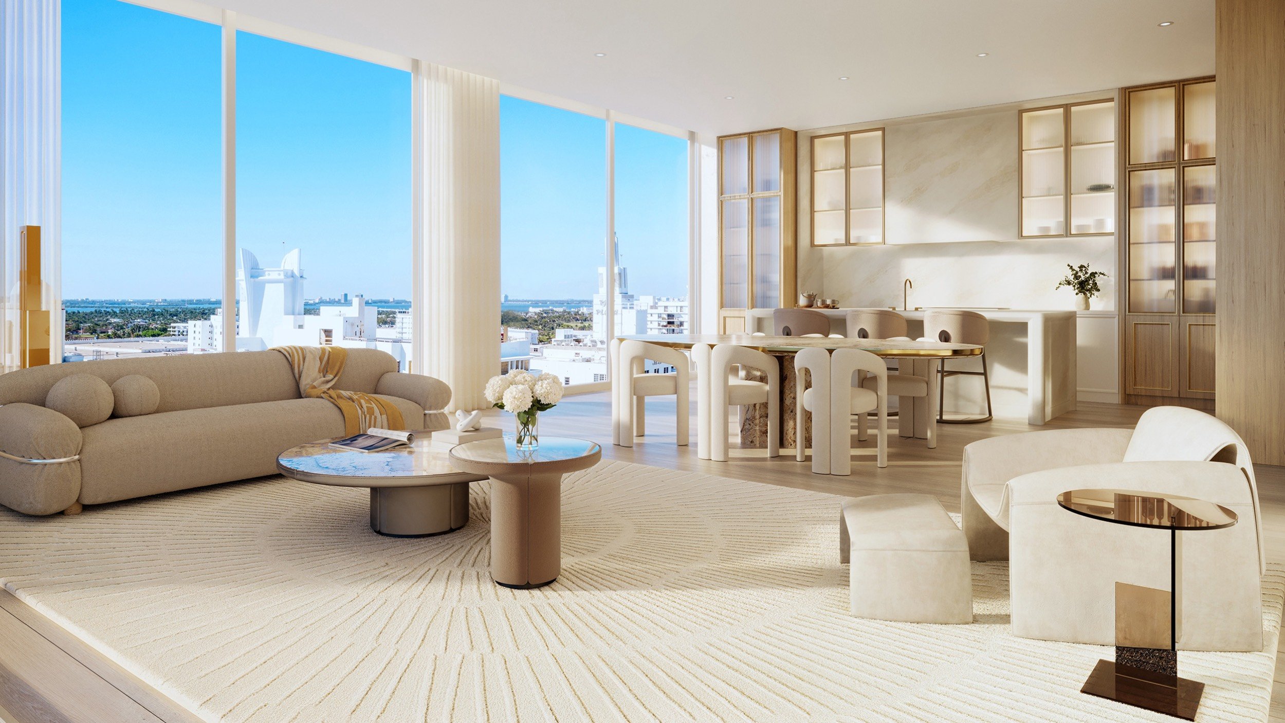 The Ritz‑Carlton South Beach living room with skyline and ocean views, Miami Beach, exclusive setting for luxury and ultra luxury condos; resale. Featuring modern interior view.