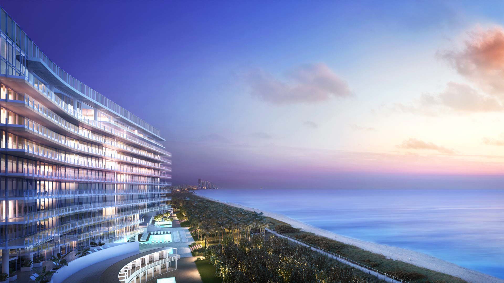 Twilight exterior panorama of the curved oceanfront condo facade and shoreline at The Surf Club Four Seasons, Fort Lauderdale luxury and ultra luxury condos.