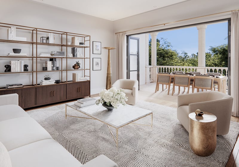 The Village at Coral Gables condo residences living room in Coral Gables, Miami with modern seating and sliding doors to a covered loggia terrace with outdoor dining; luxury and ultra luxury preconstruction condos.