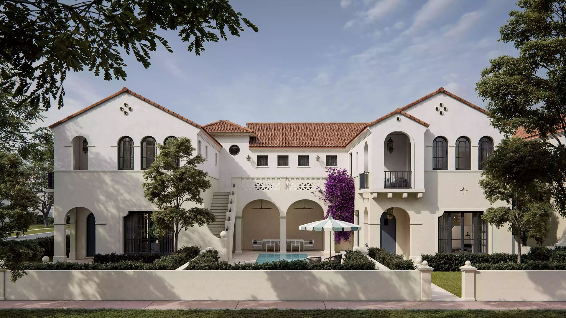 The Village at Coral Gables townhomes courtyard in Coral Gables, Miami with private pool, arched loggia, terrace seating and bougainvillea; luxury and ultra luxury preconstruction condos and townhomes.