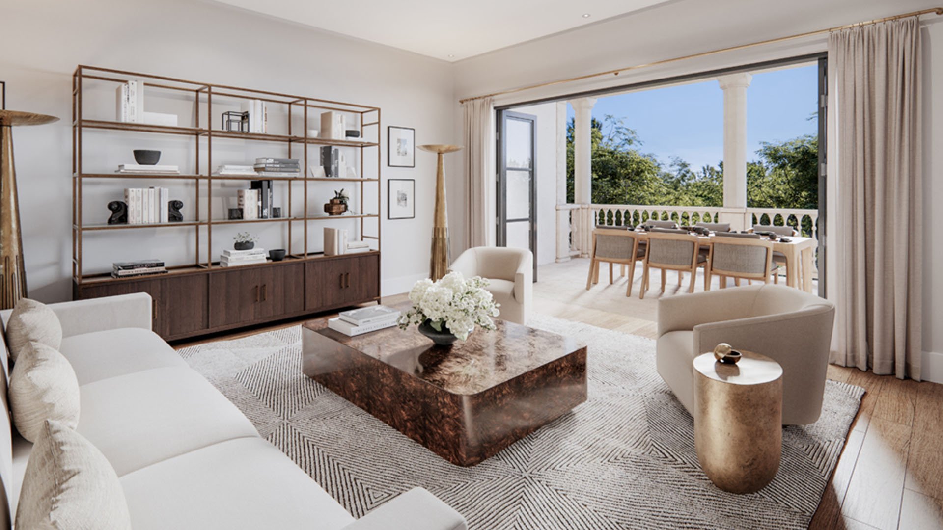 The Village at Coral Gables flats living room in Coral Gables, Miami opening to covered loggia terrace with outdoor dining and greenery views; luxury and ultra luxury preconstruction condos.
