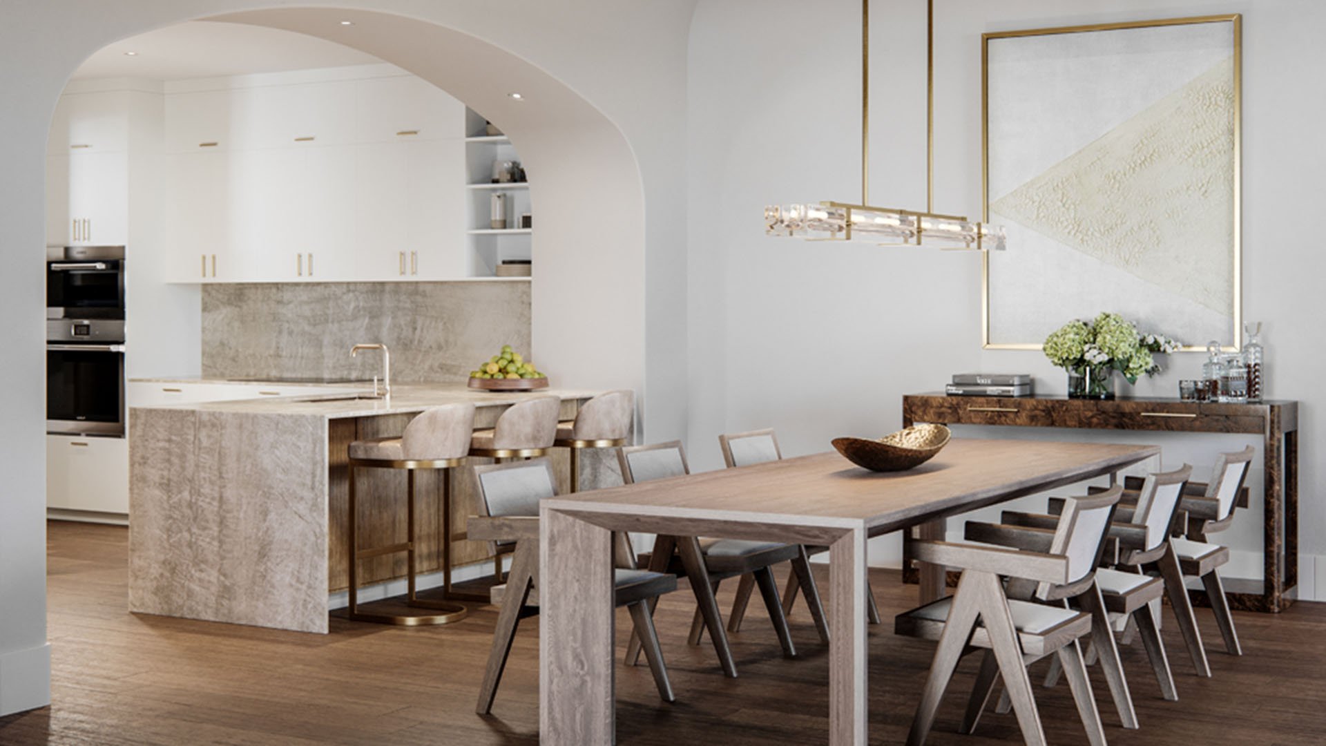 The Village at Coral Gables flats open-concept kitchen and dining in Coral Gables, Miami with arched entry, oversized table, island seating and modern lighting; luxury and ultra luxury preconstruction condos.