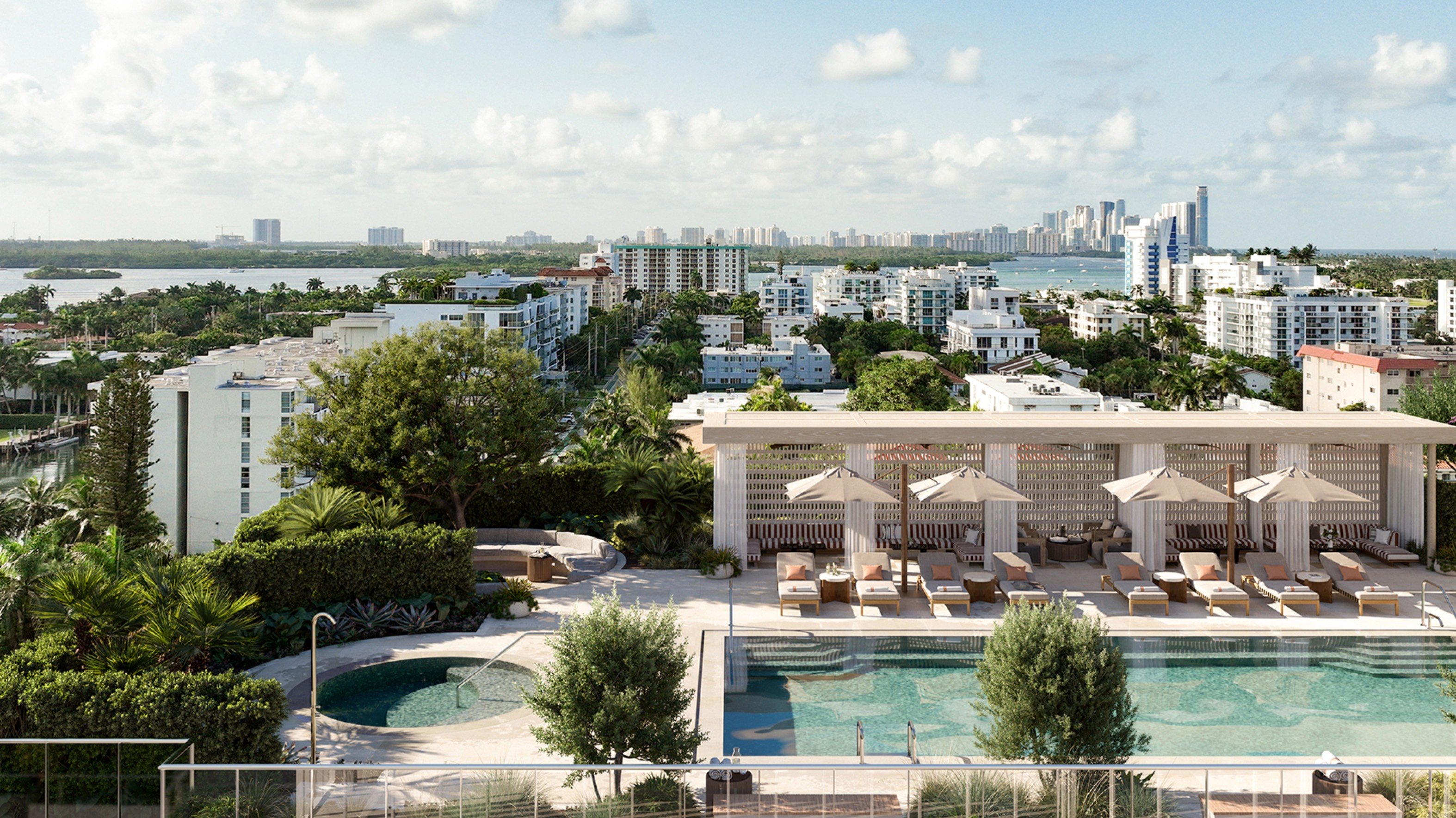 THE WELL Bay Harbor Islands poolside view with Miami skyline. Bay Harbor Islands; wellness‑focused luxury and ultra luxury condos; preconstruction. Featuring cityscape.