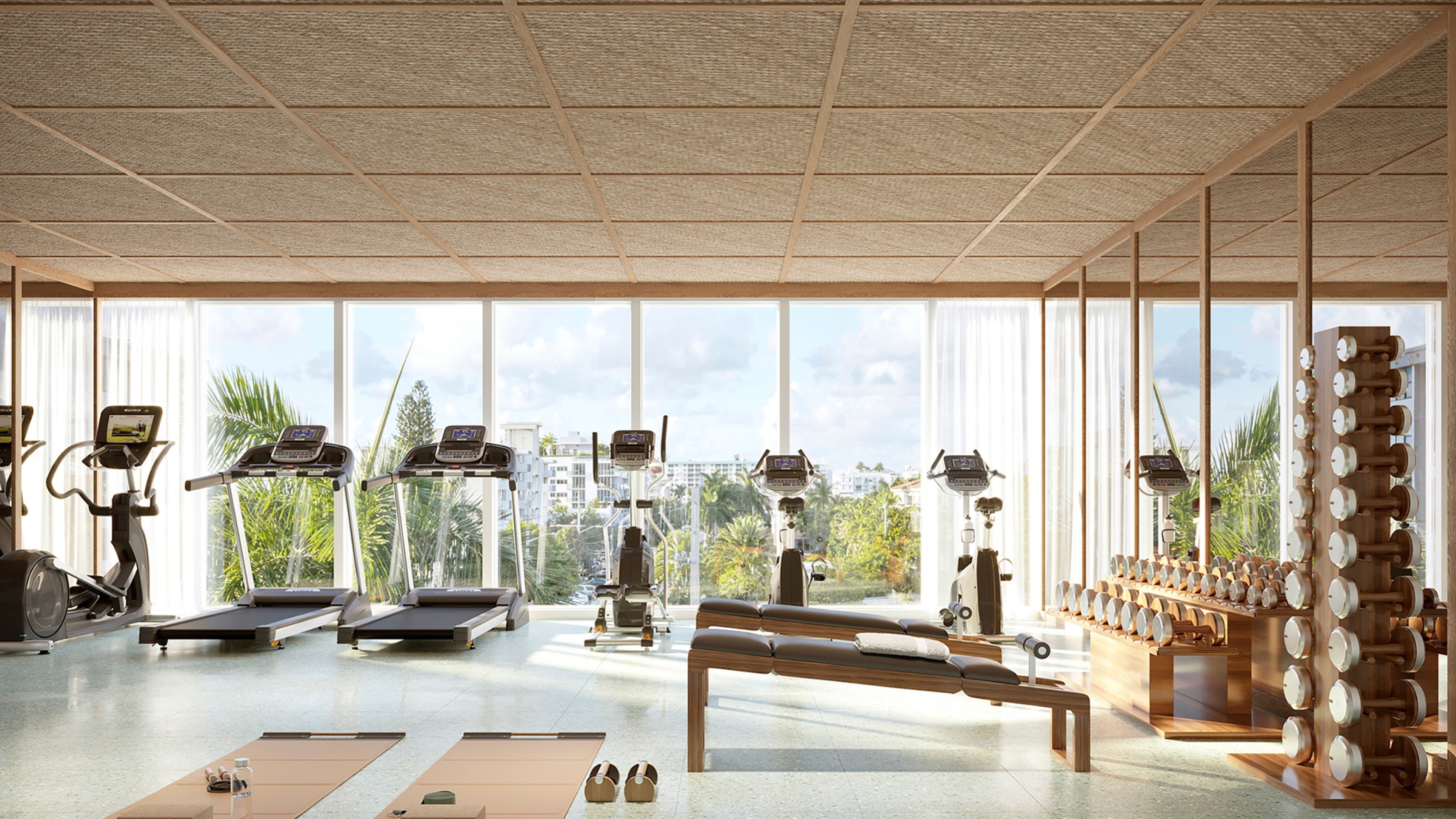 THE WELL Bay Harbor Islands modern gym with warm wood architecture. Bay Harbor Islands, Miami; wellness amenity for luxury and ultra luxury condos; preconstruction. Featuring interior and wooden.