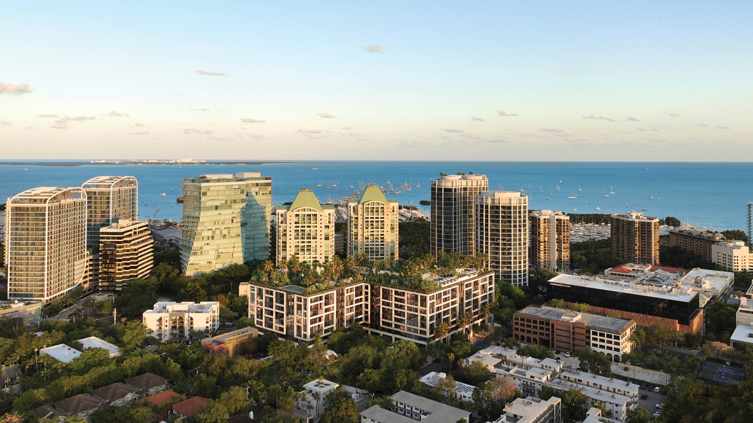 THE WELL Coconut Grove, Miami coastal high‑rise cityscape at sunset, bayfront zone for luxury and ultra luxury condos; preconstruction.