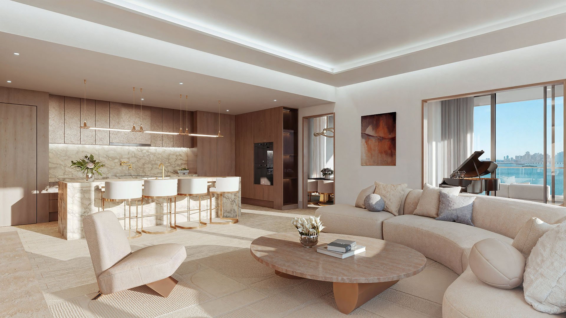 Open-plan great room with chef kitchen, curved sofa, and a grand piano near bay windows at Tula Residences in North Bay Village, reflecting luxury and ultra luxury condos with expansive entertaining space and refined finishes.